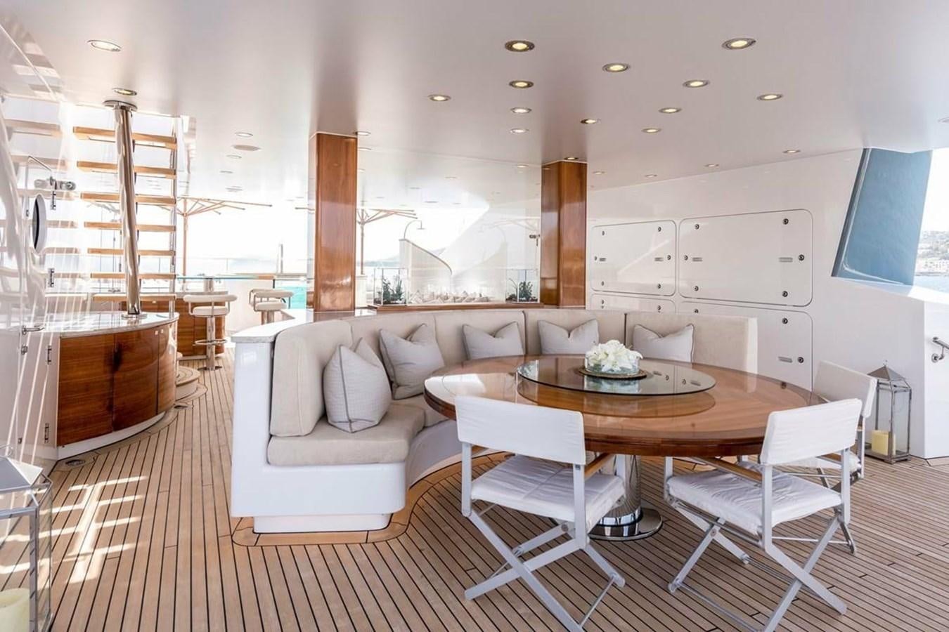 a living room with a table and chairs aboard TALISMAN C Yacht for Sale