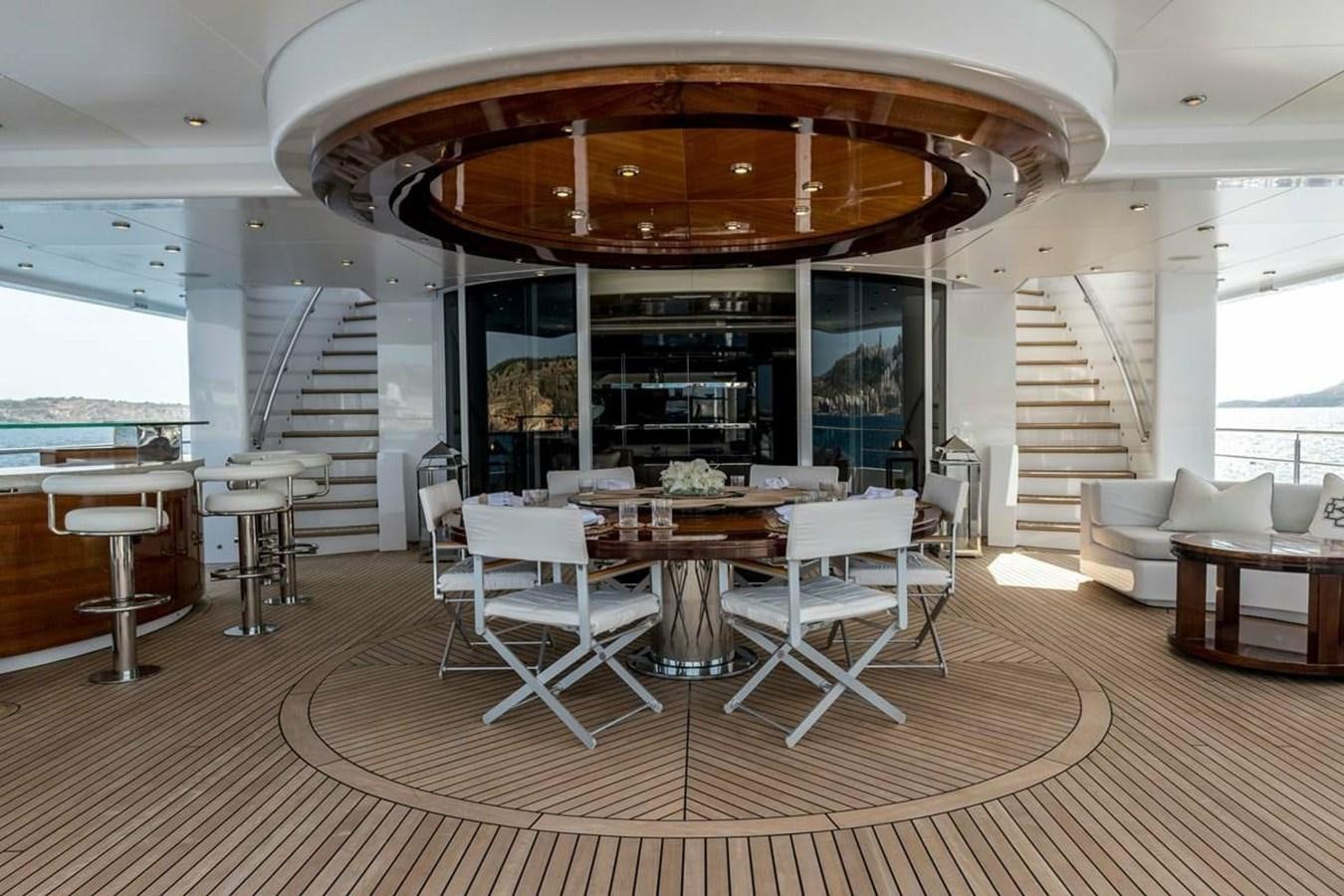 a room with tables and chairs aboard TALISMAN C Yacht for Sale