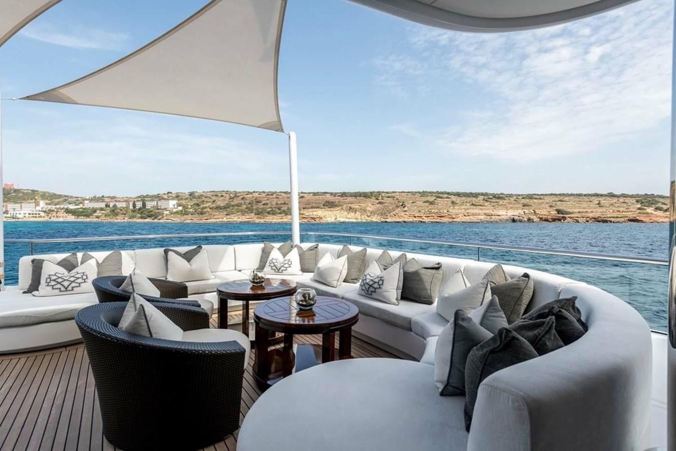 a room with a table and chairs aboard TALISMAN C Yacht for Sale