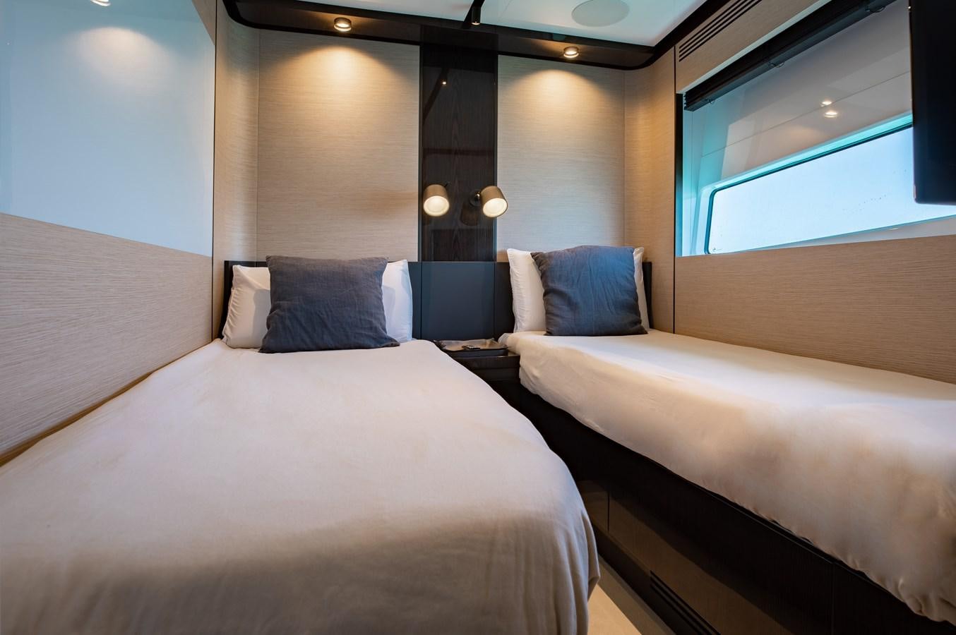 a room with two beds aboard BASH II Yacht for Sale