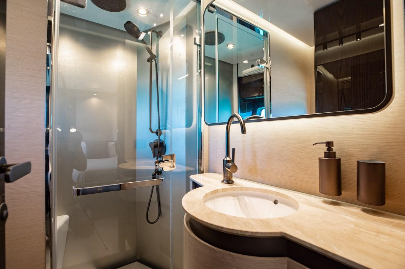 a bathroom with a glass shower aboard BASH II Yacht for Sale