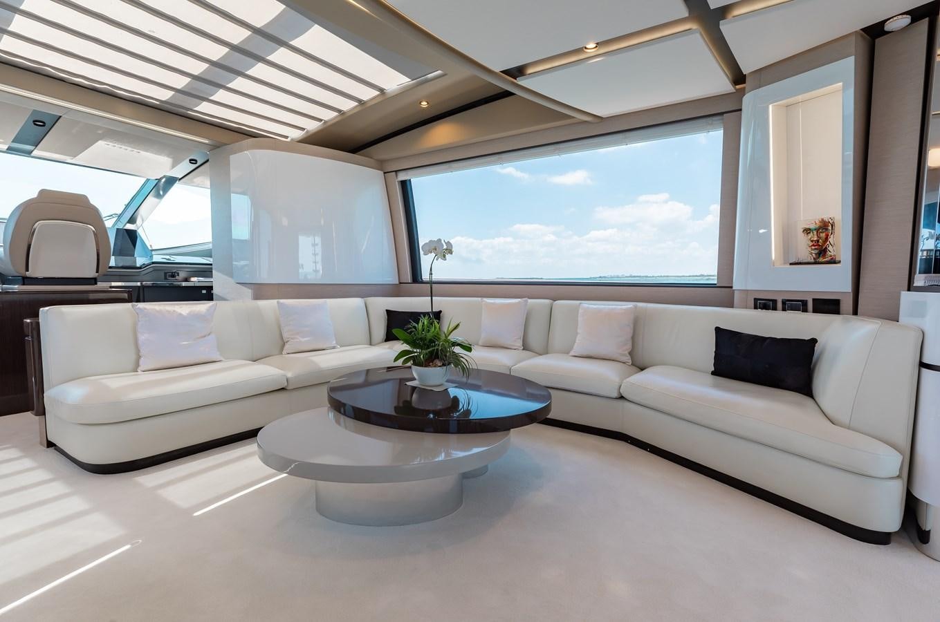 a living room with a large window aboard BASH II Yacht for Sale
