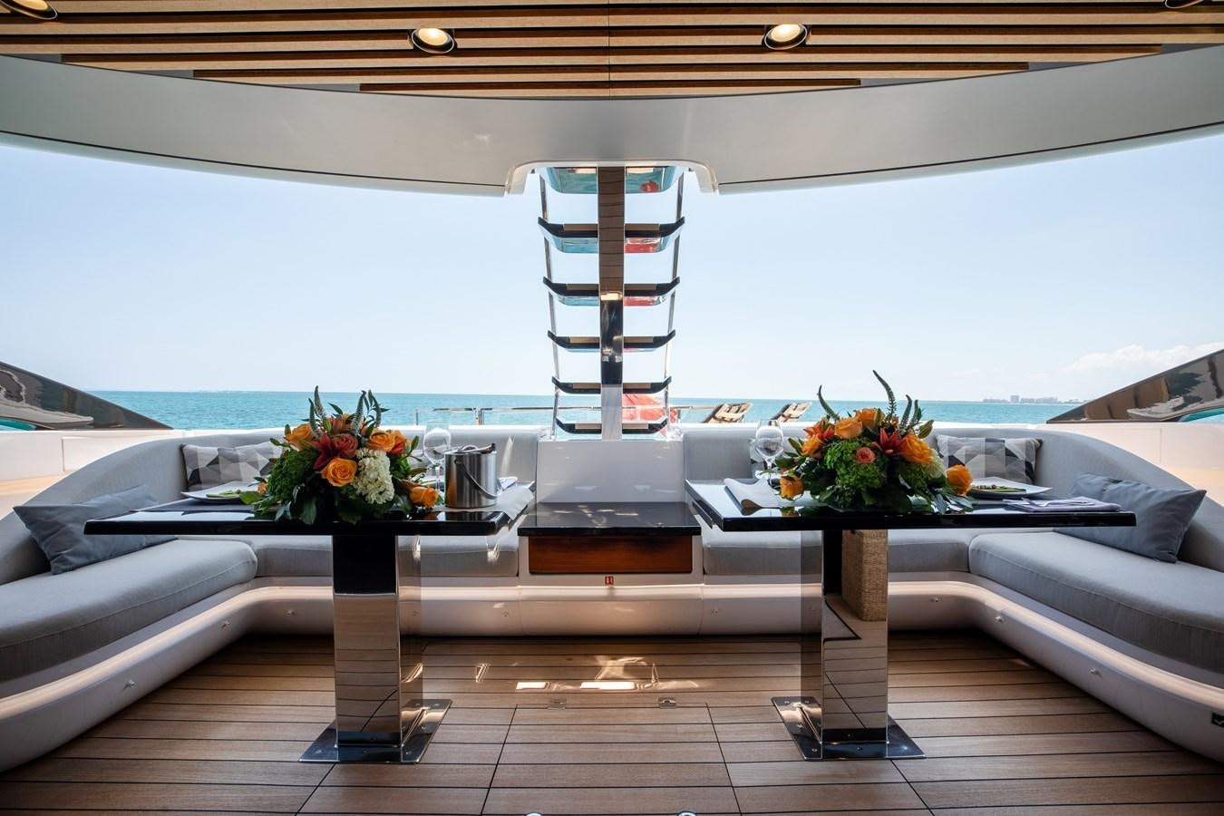 a table with flowers on it aboard BASH II Yacht for Sale