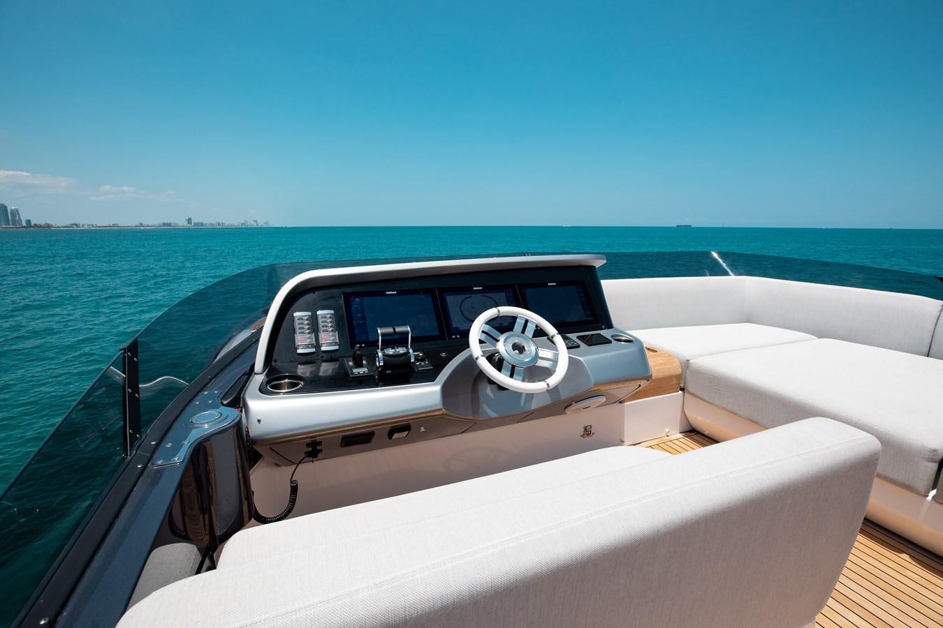 a car driving on a boat aboard BASH II Yacht for Sale