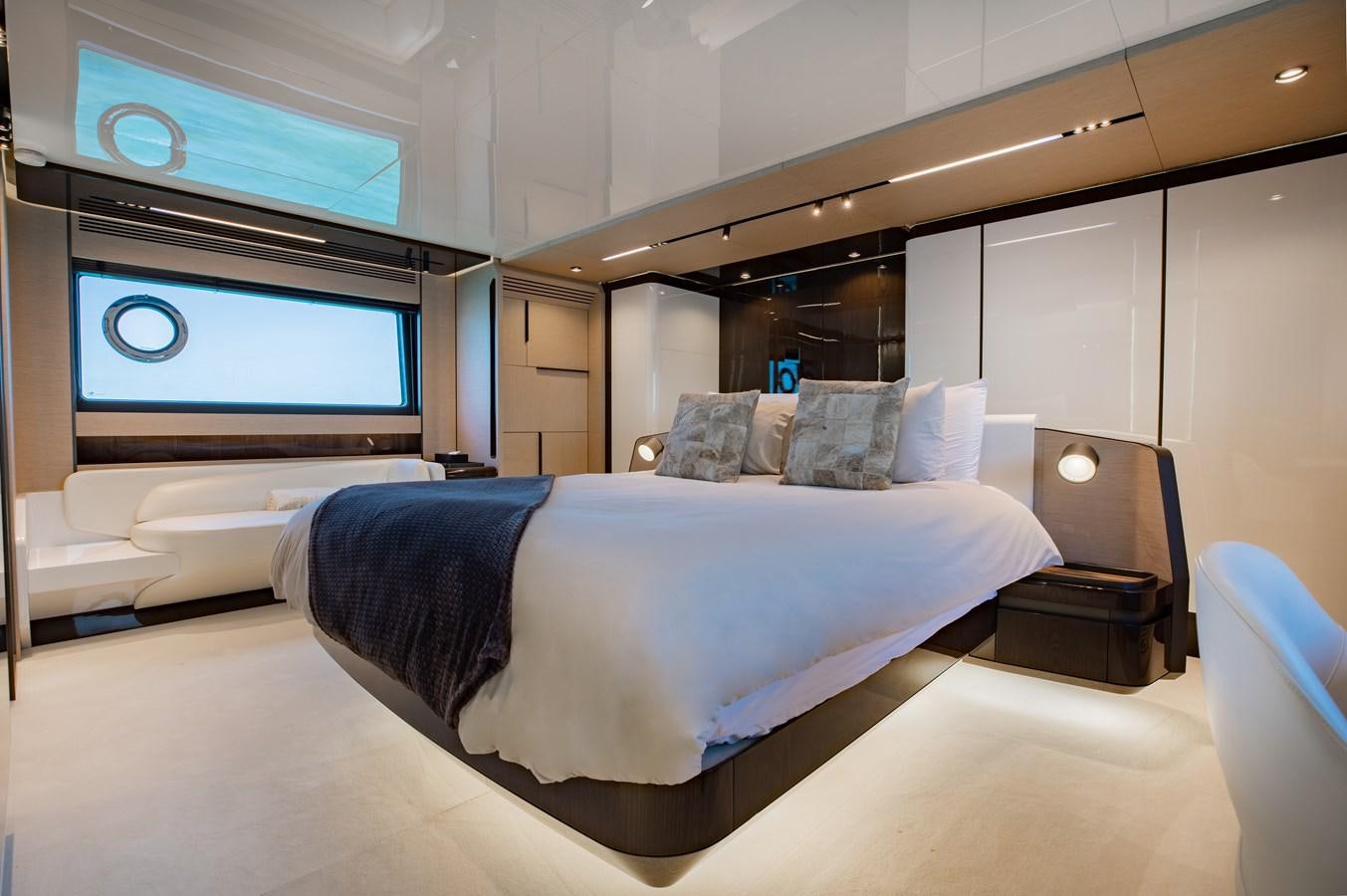 a large bed in a room aboard BASH II Yacht for Sale