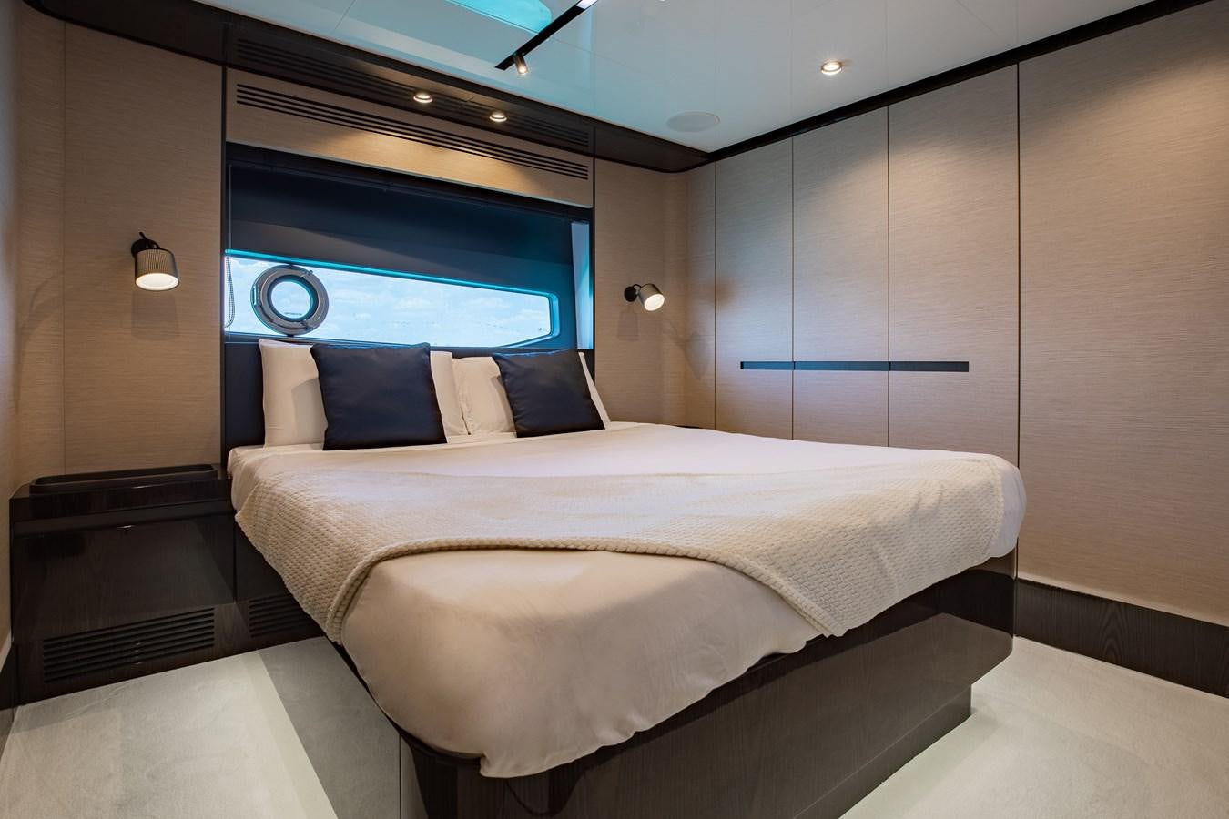 a bed in a room aboard BASH II Yacht for Sale