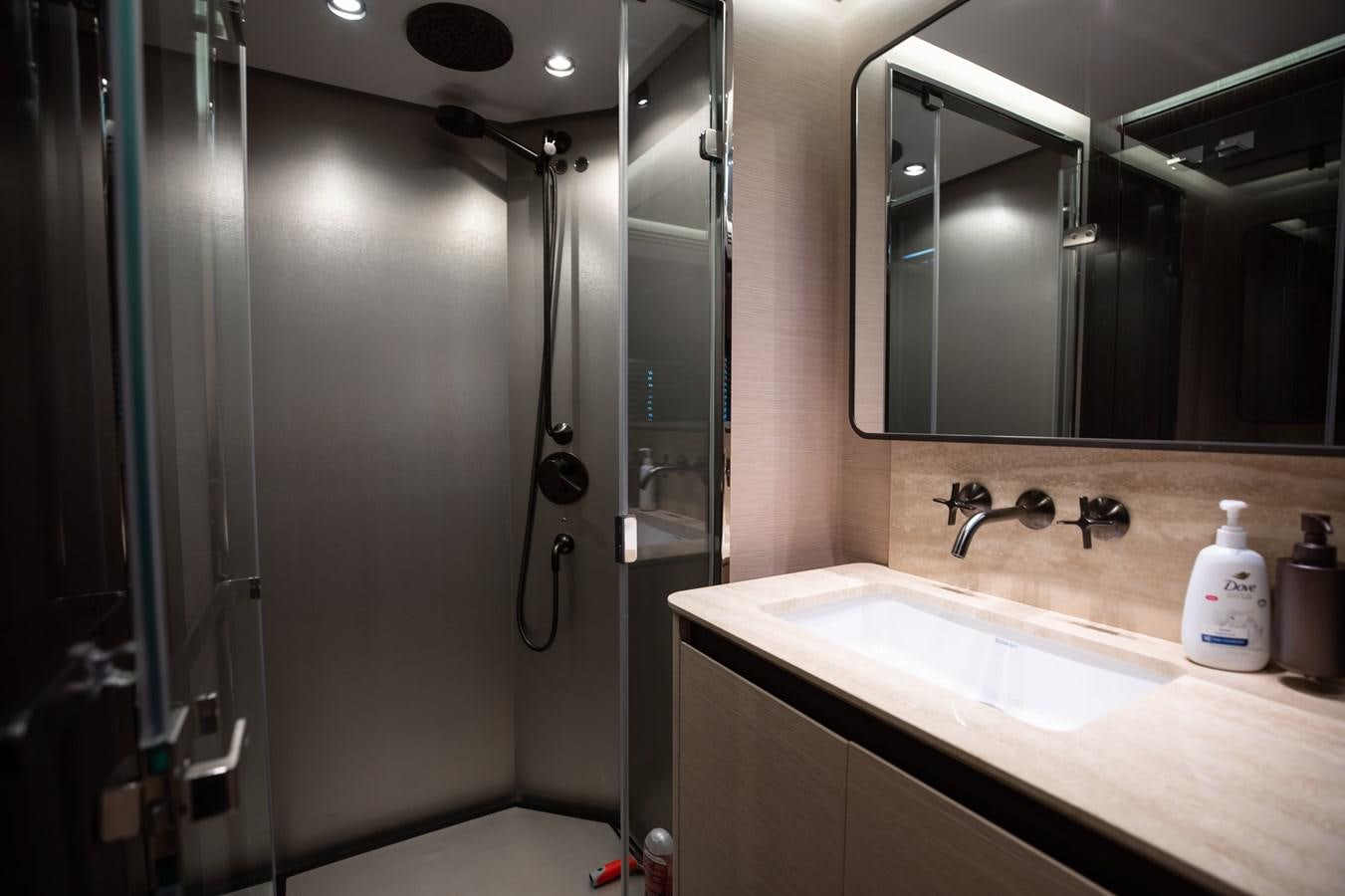 a bathroom with a large mirror aboard BASH II Yacht for Sale