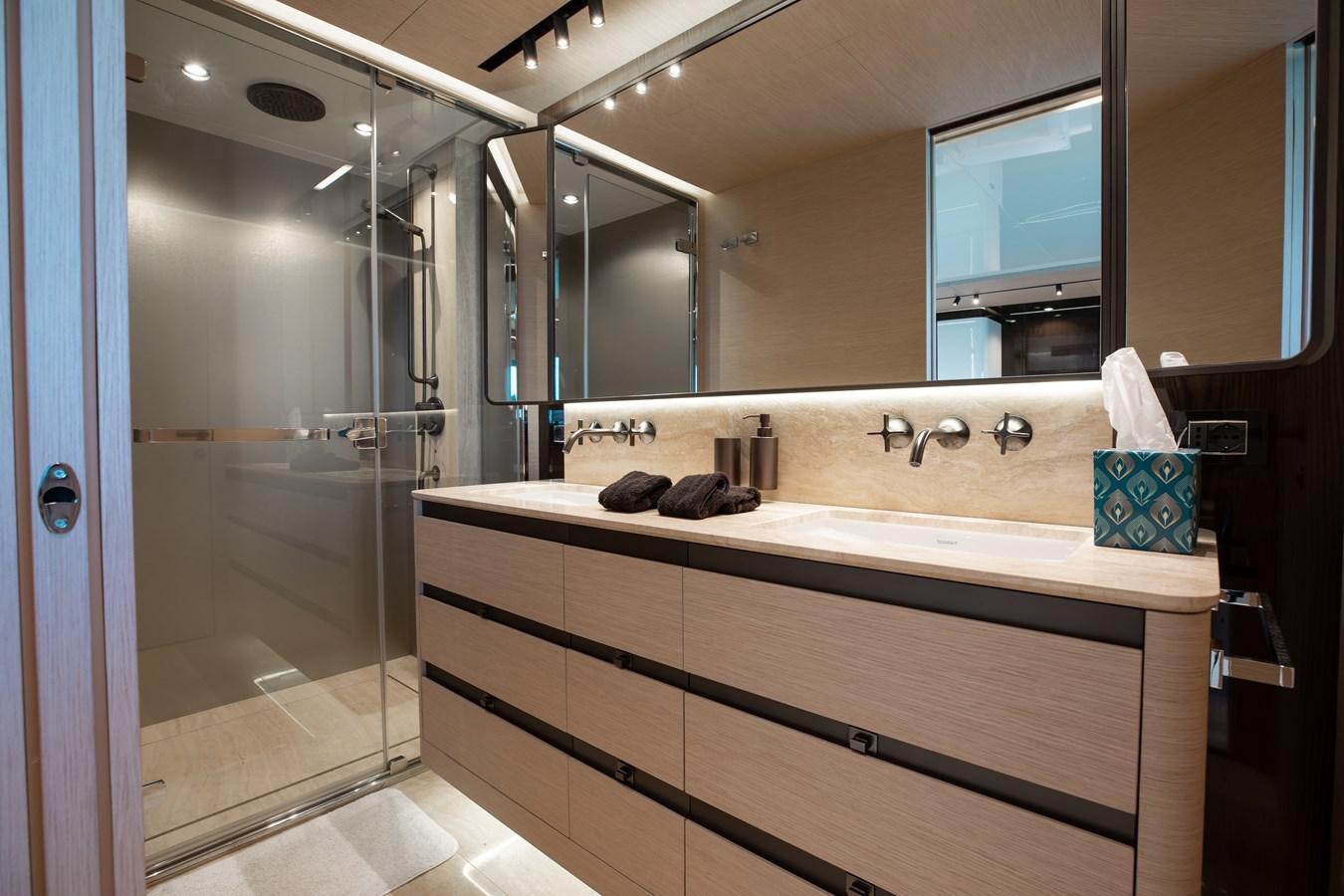 a bathroom with a large mirror aboard BASH II Yacht for Sale