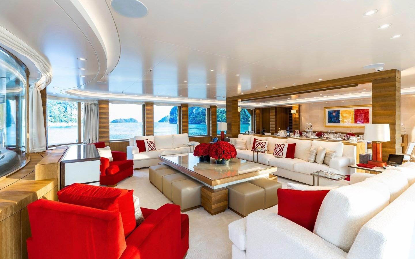 a living room with white couches and a large window aboard FELIX Yacht for Sale