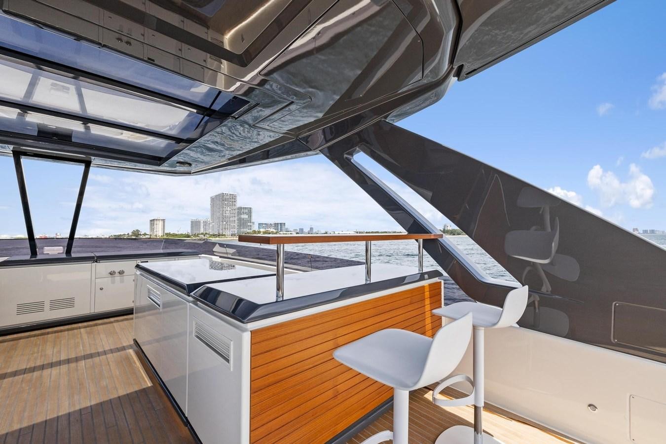 a deck with a large building and a pool aboard XFAF8532J021 Yacht for Sale