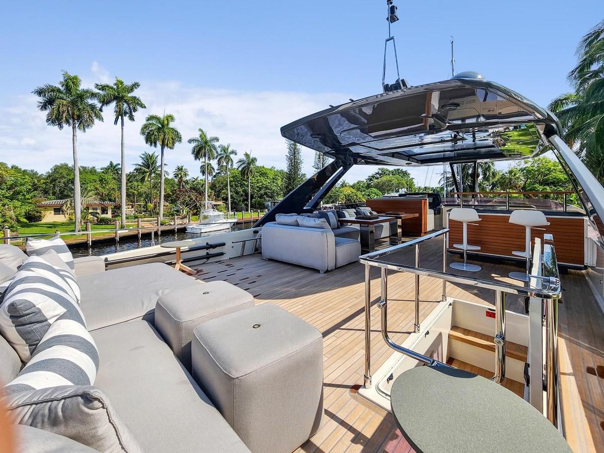 a deck with a pool and a boat on it aboard XFAF8532J021 Yacht for Sale