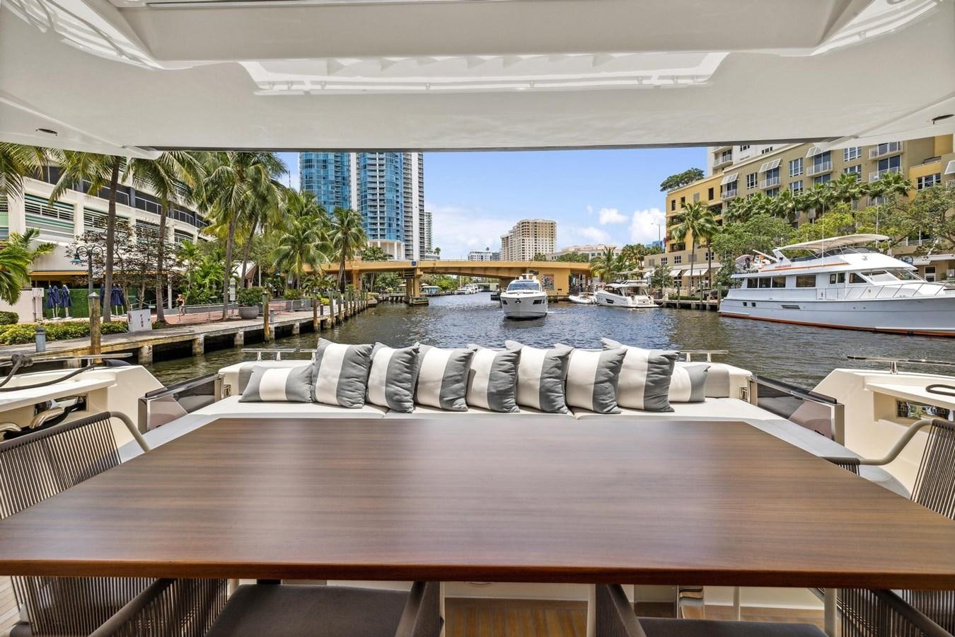 a table with chairs on it aboard XFAF8532J021 Yacht for Sale