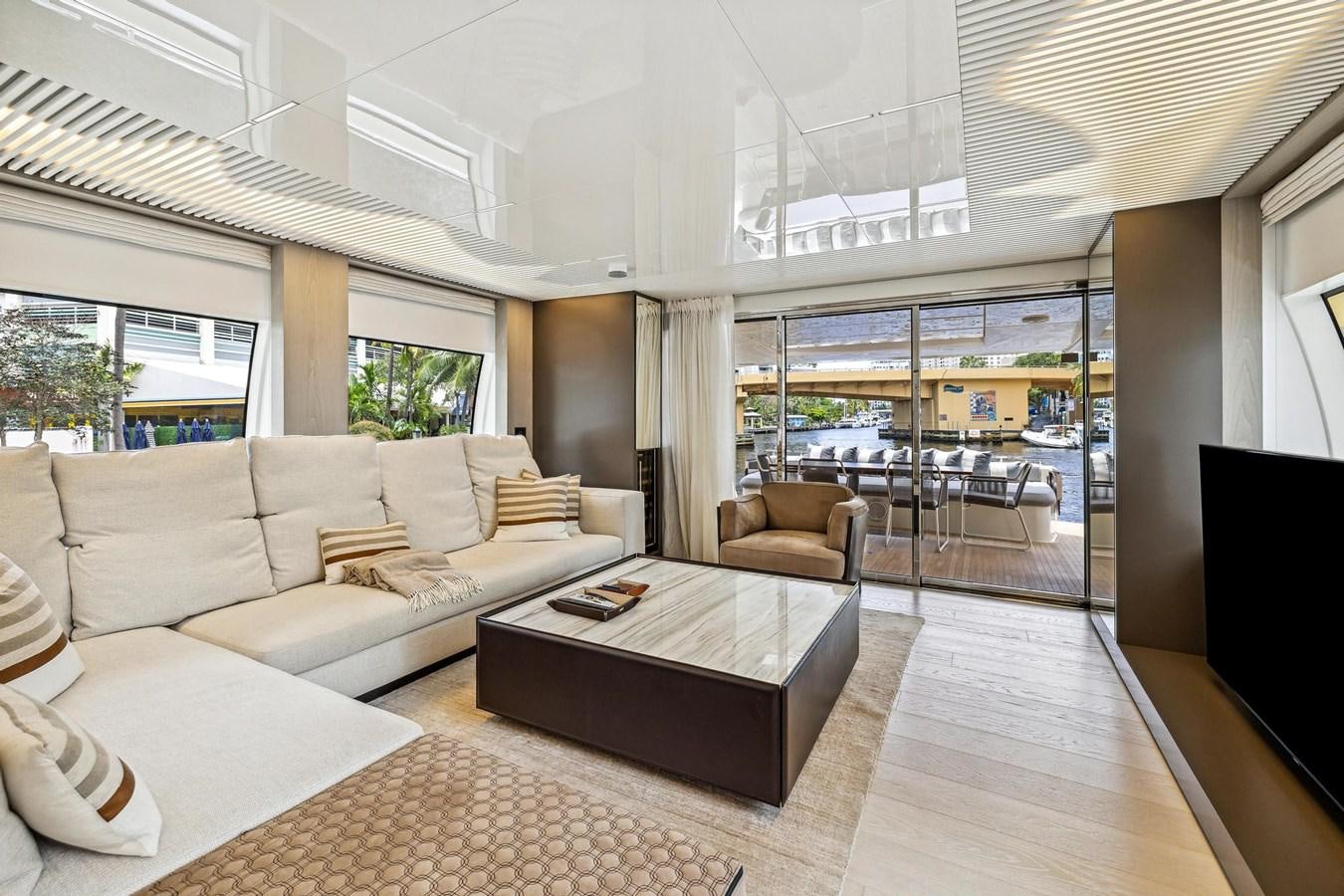 a living room with a large window aboard XFAF8532J021 Yacht for Sale