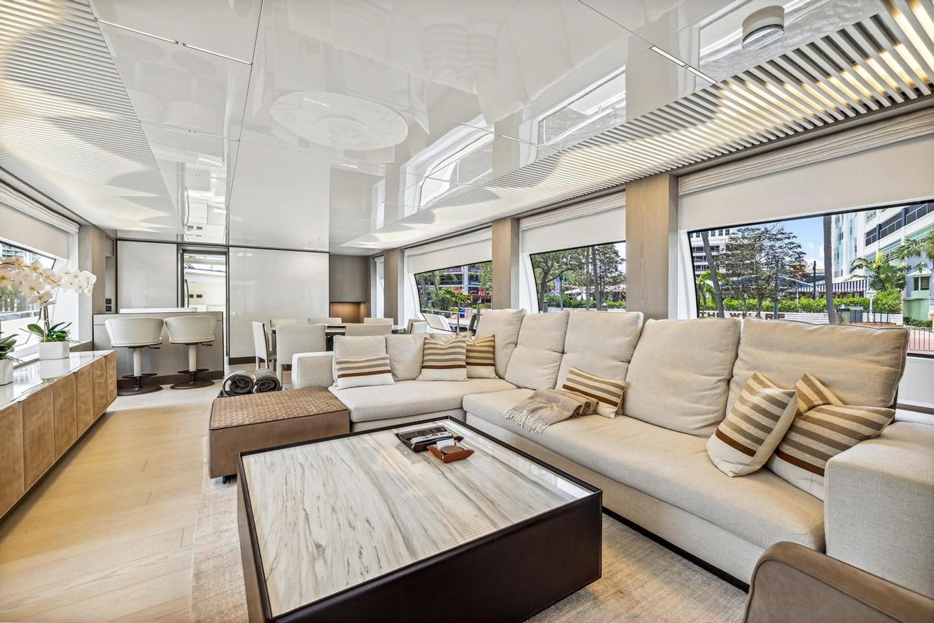 a living room with a large window aboard XFAF8532J021 Yacht for Sale