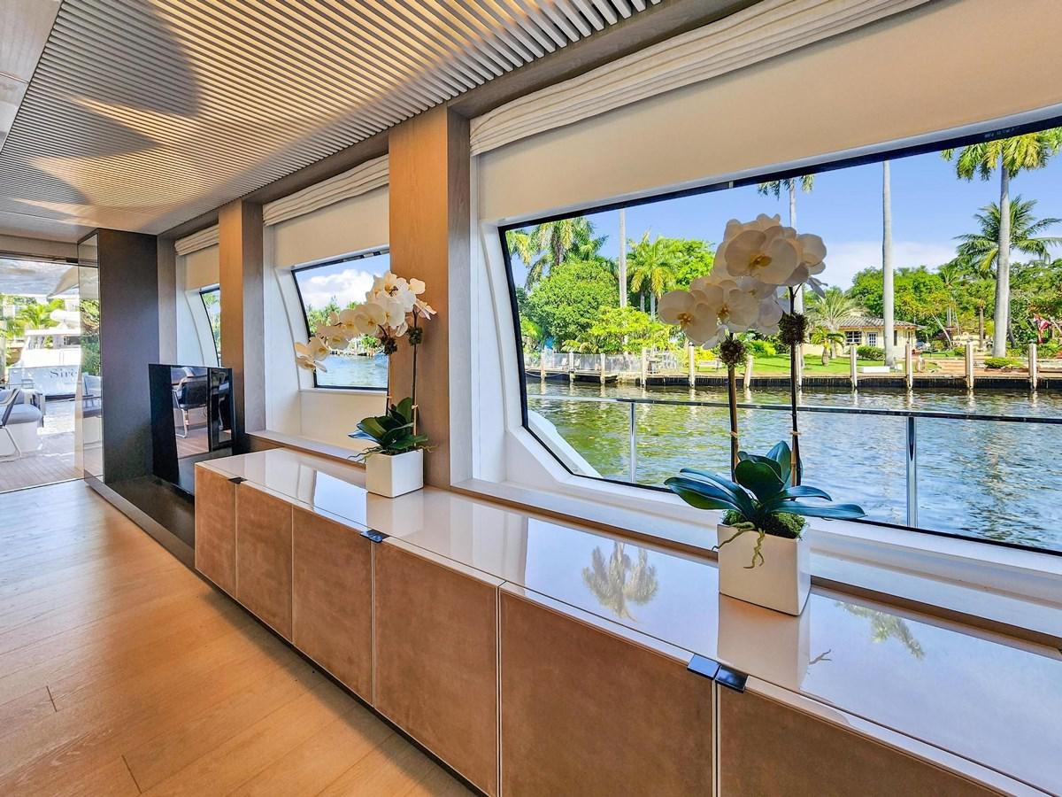 a room with a large window and a plant in it aboard XFAF8532J021 Yacht for Sale