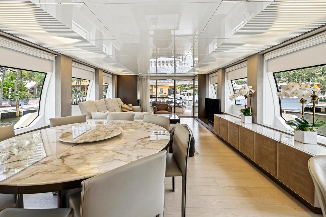 a large room with a table and chairs aboard XFAF8532J021 Yacht for Sale