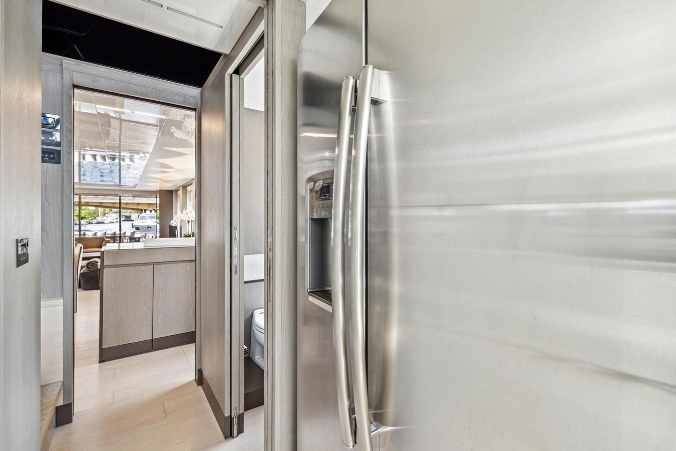 a large silver refrigerator in a kitchen aboard XFAF8532J021 Yacht for Sale