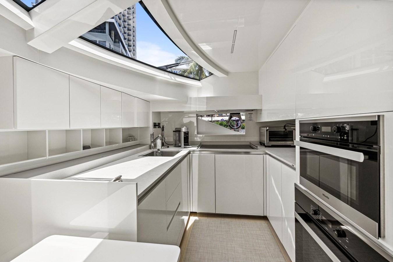 a kitchen with white cabinets aboard XFAF8532J021 Yacht for Sale