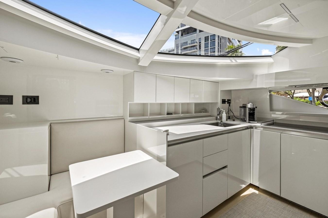 a kitchen with white cabinets aboard XFAF8532J021 Yacht for Sale