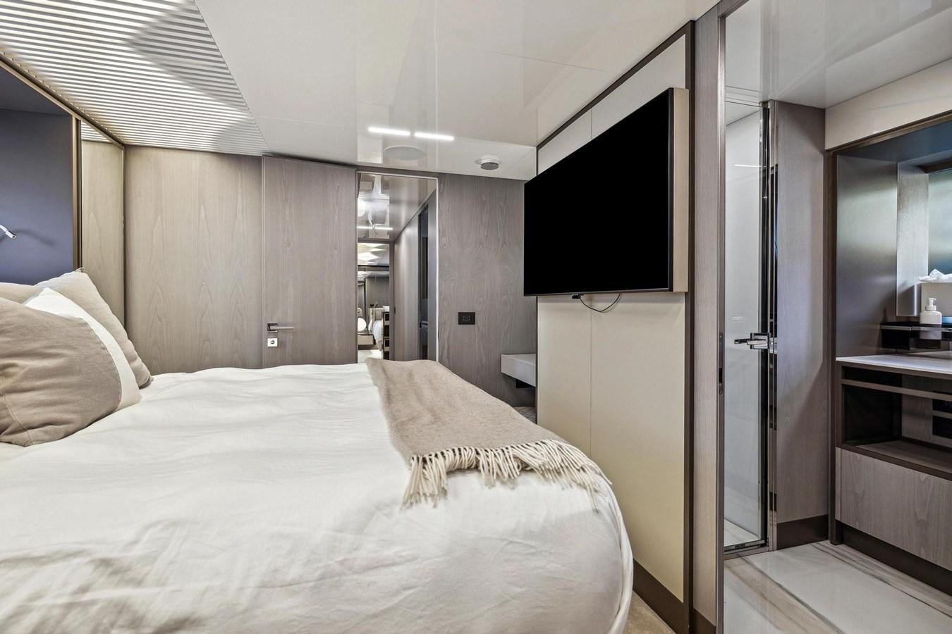 a bedroom with a bed and a tv aboard XFAF8532J021 Yacht for Sale