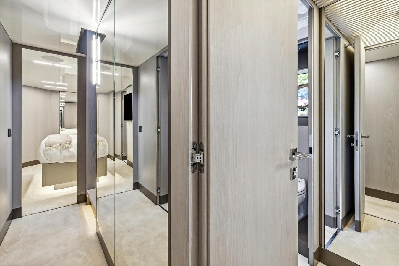 a room with a bed and a mirror aboard XFAF8532J021 Yacht for Sale