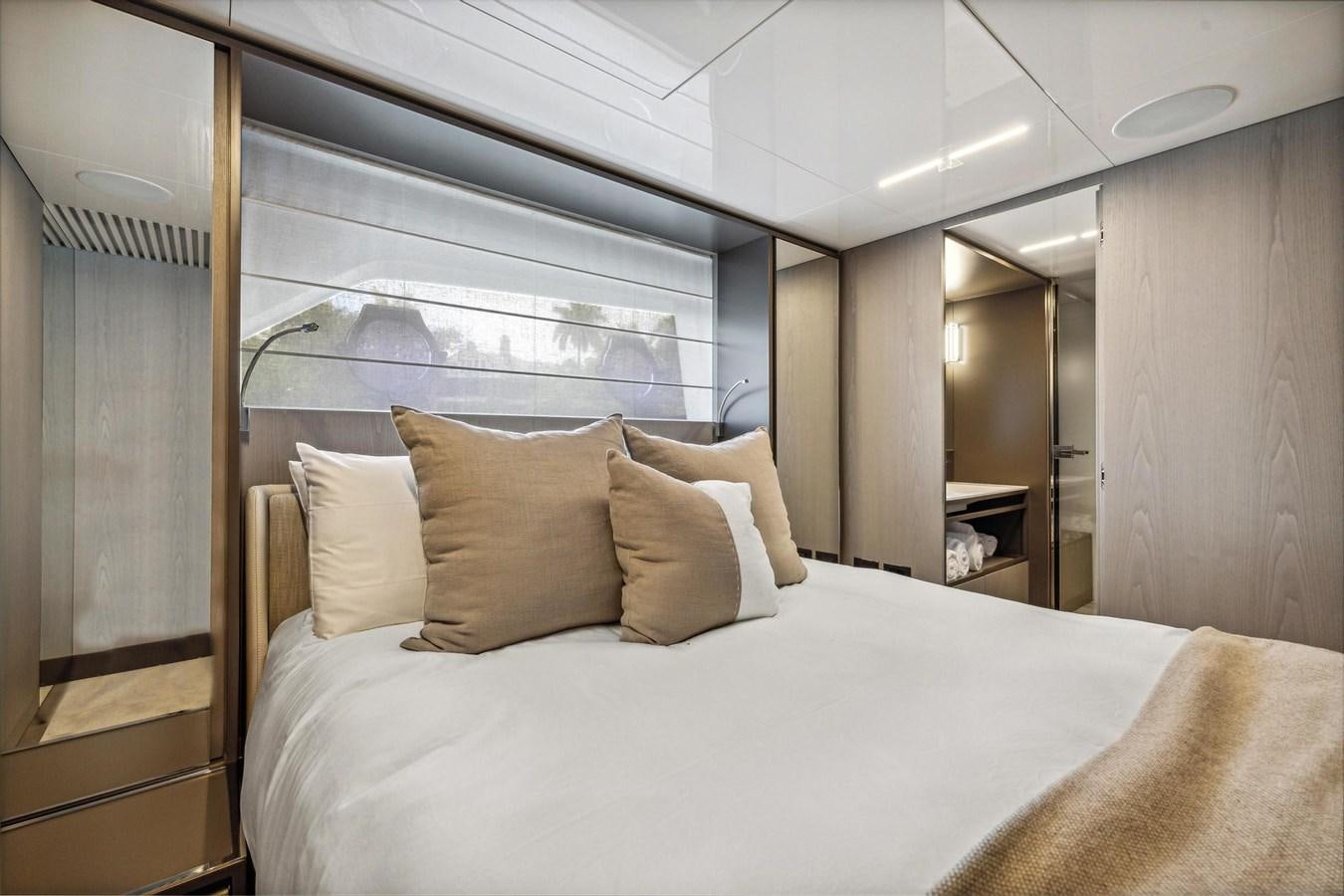 a bed with pillows aboard XFAF8532J021 Yacht for Sale