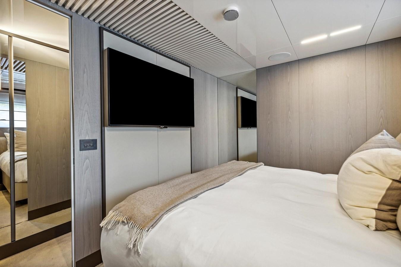 a bedroom with a bed and a television aboard XFAF8532J021 Yacht for Sale