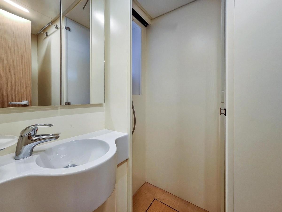 a bathroom with a sink and a mirror aboard XFAF8532J021 Yacht for Sale