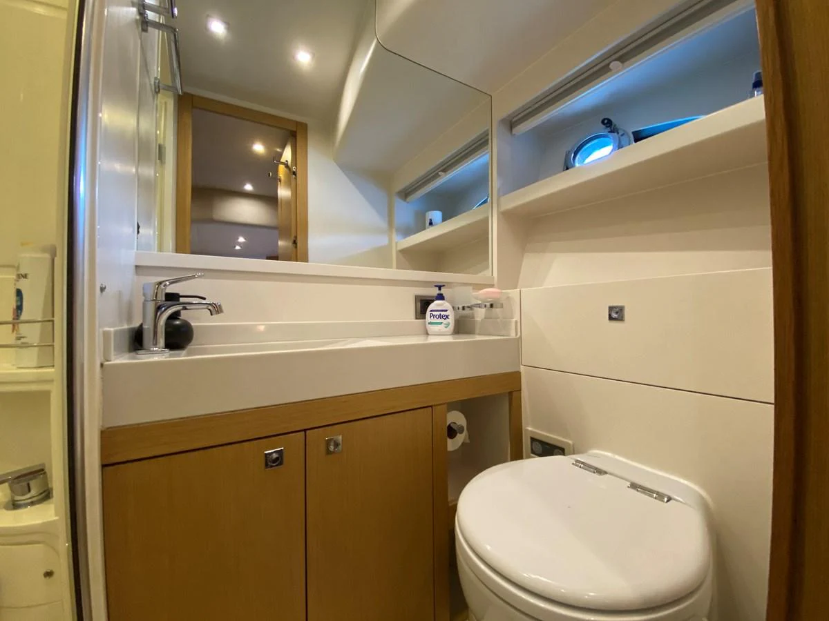 a bathroom with a toilet and a sink aboard MR CORN Yacht for Sale
