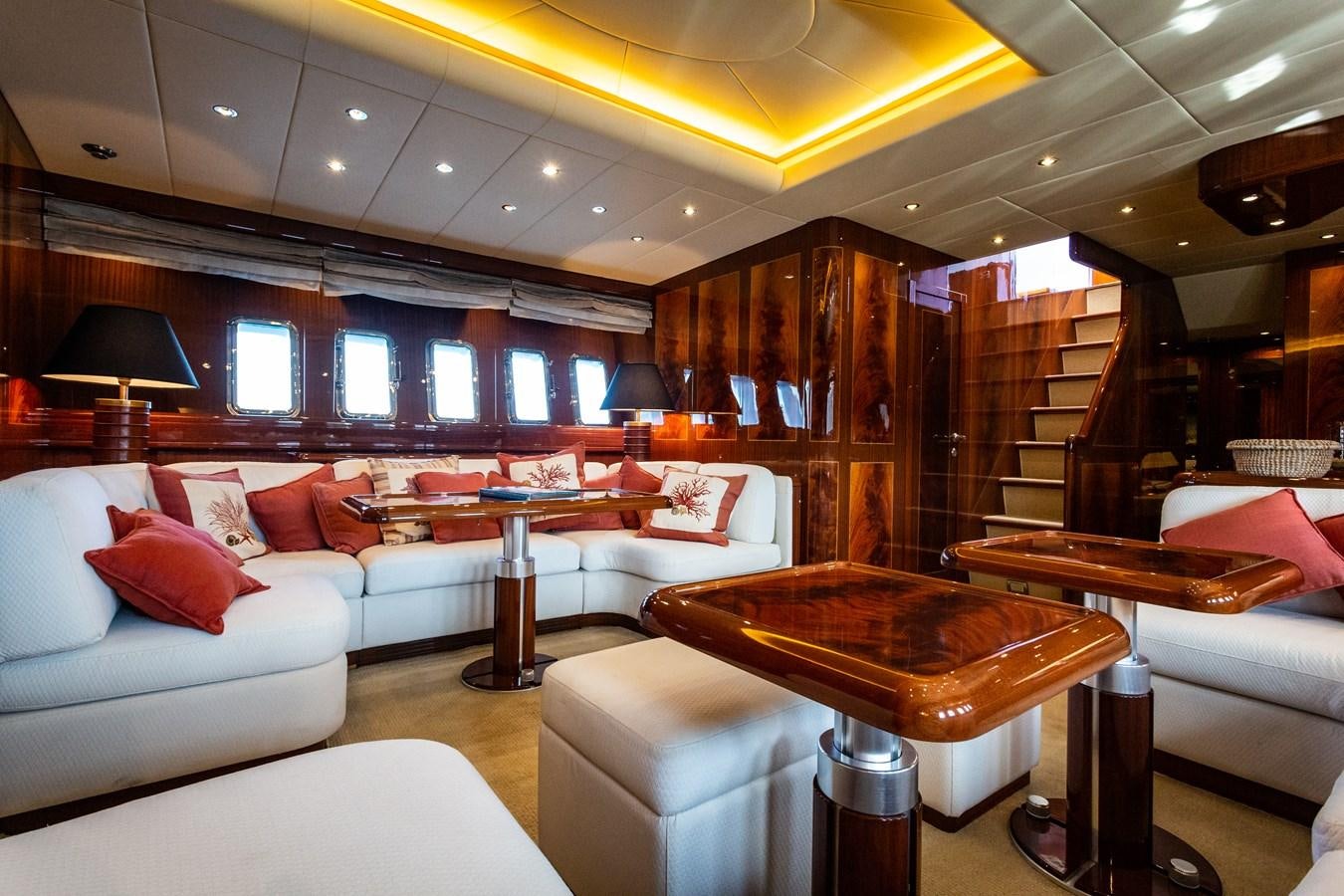 a living room with a couch and a table aboard STAND BY ME Yacht for Sale