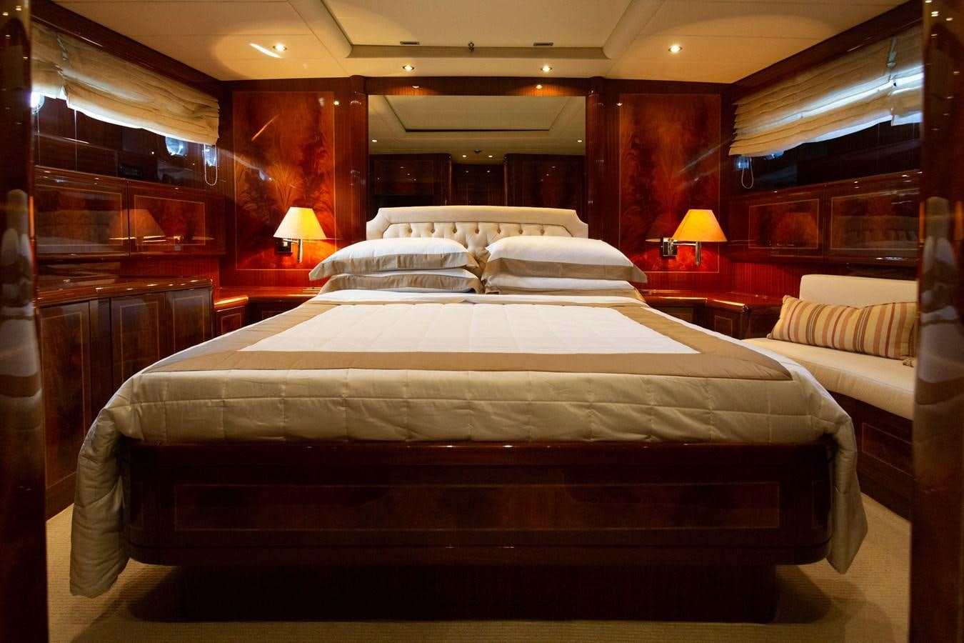 a room with a bed and a lamp aboard STAND BY ME Yacht for Sale
