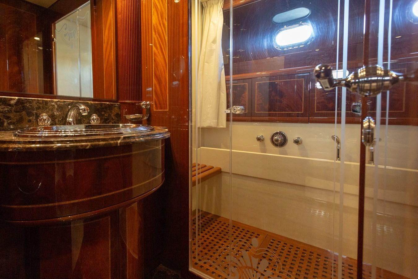 a bathroom with a glass shower aboard STAND BY ME Yacht for Sale