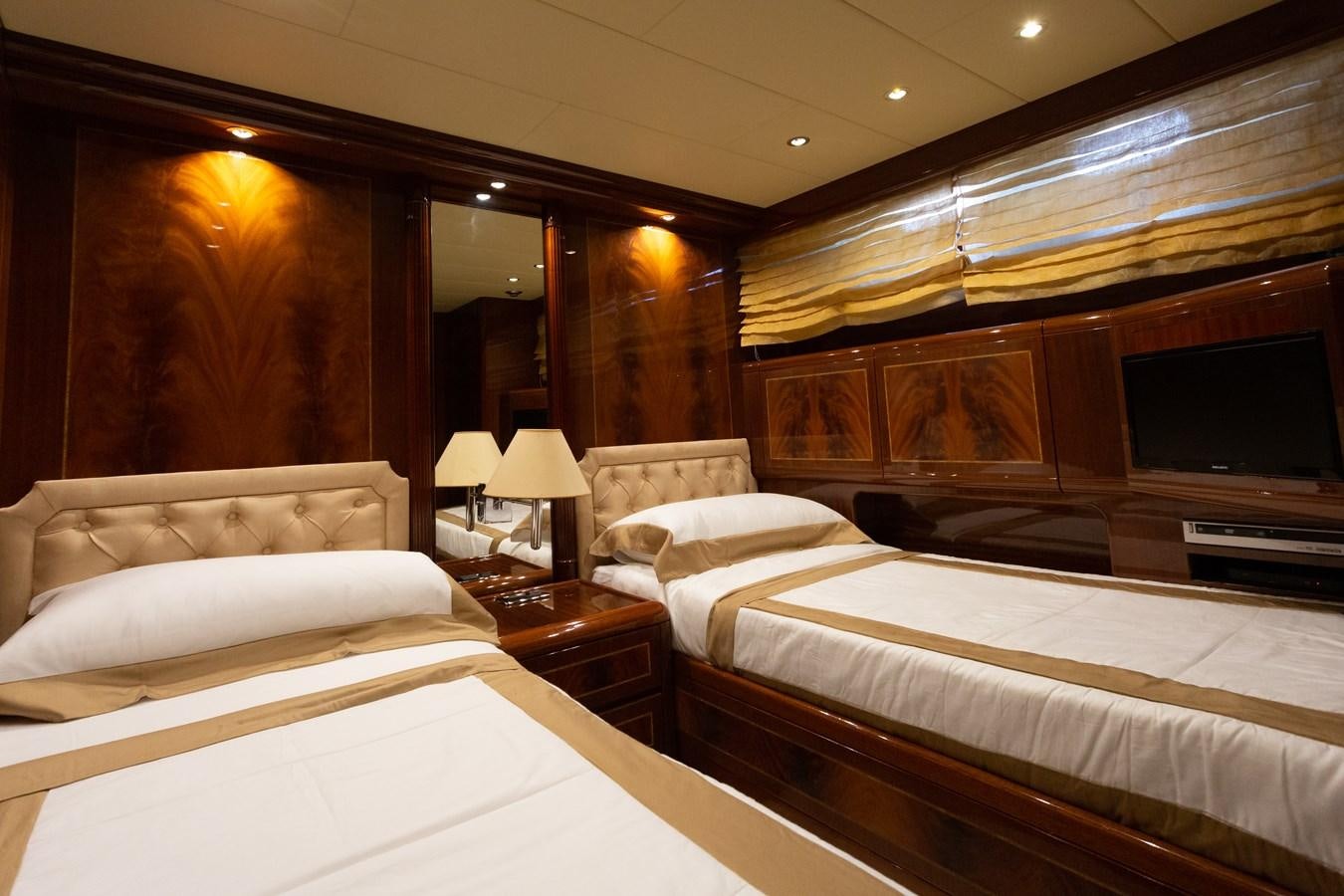 a room with a bed and a television aboard STAND BY ME Yacht for Sale