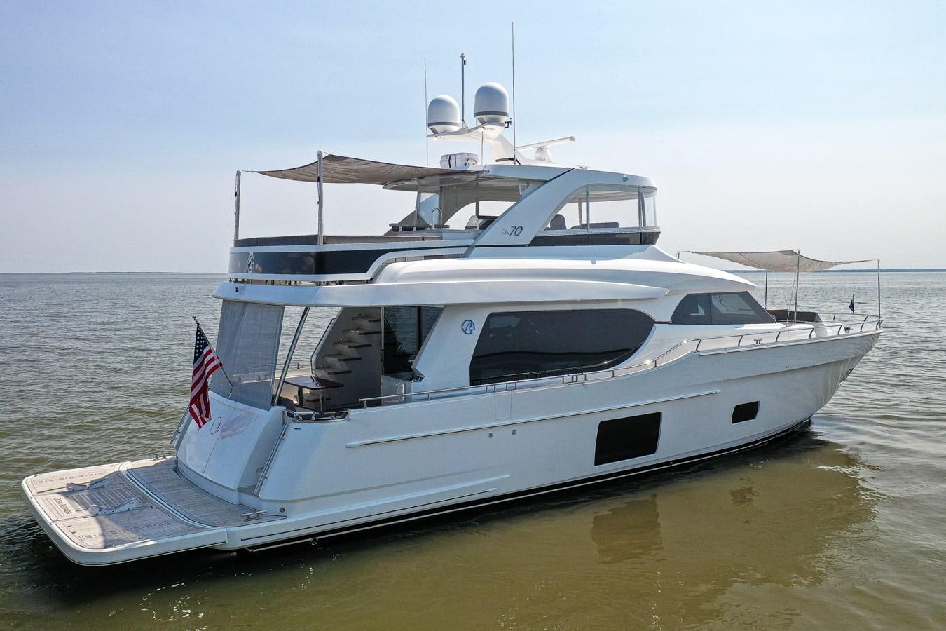 a white yacht on the water aboard 70E Yacht for Sale