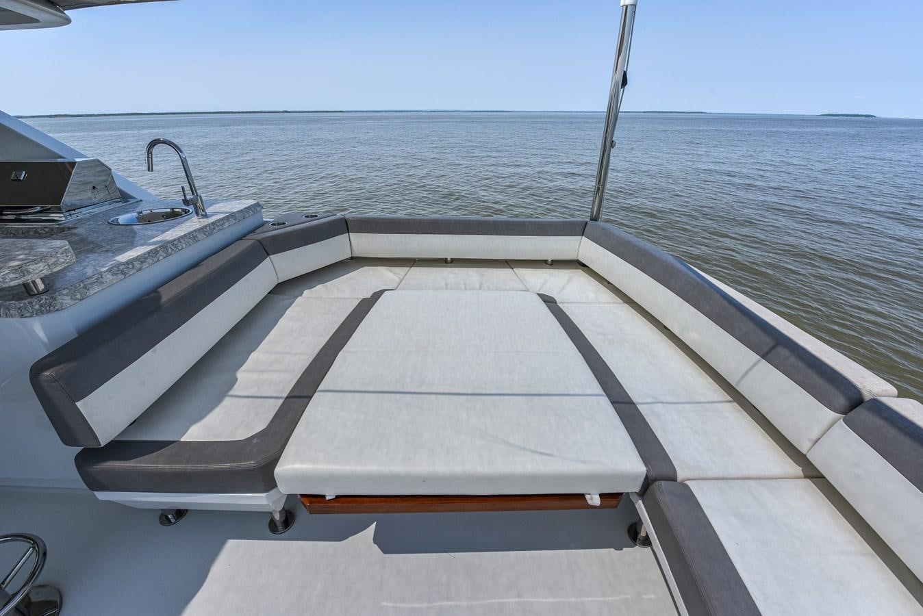 a deck with a boat on it aboard 70E Yacht for Sale