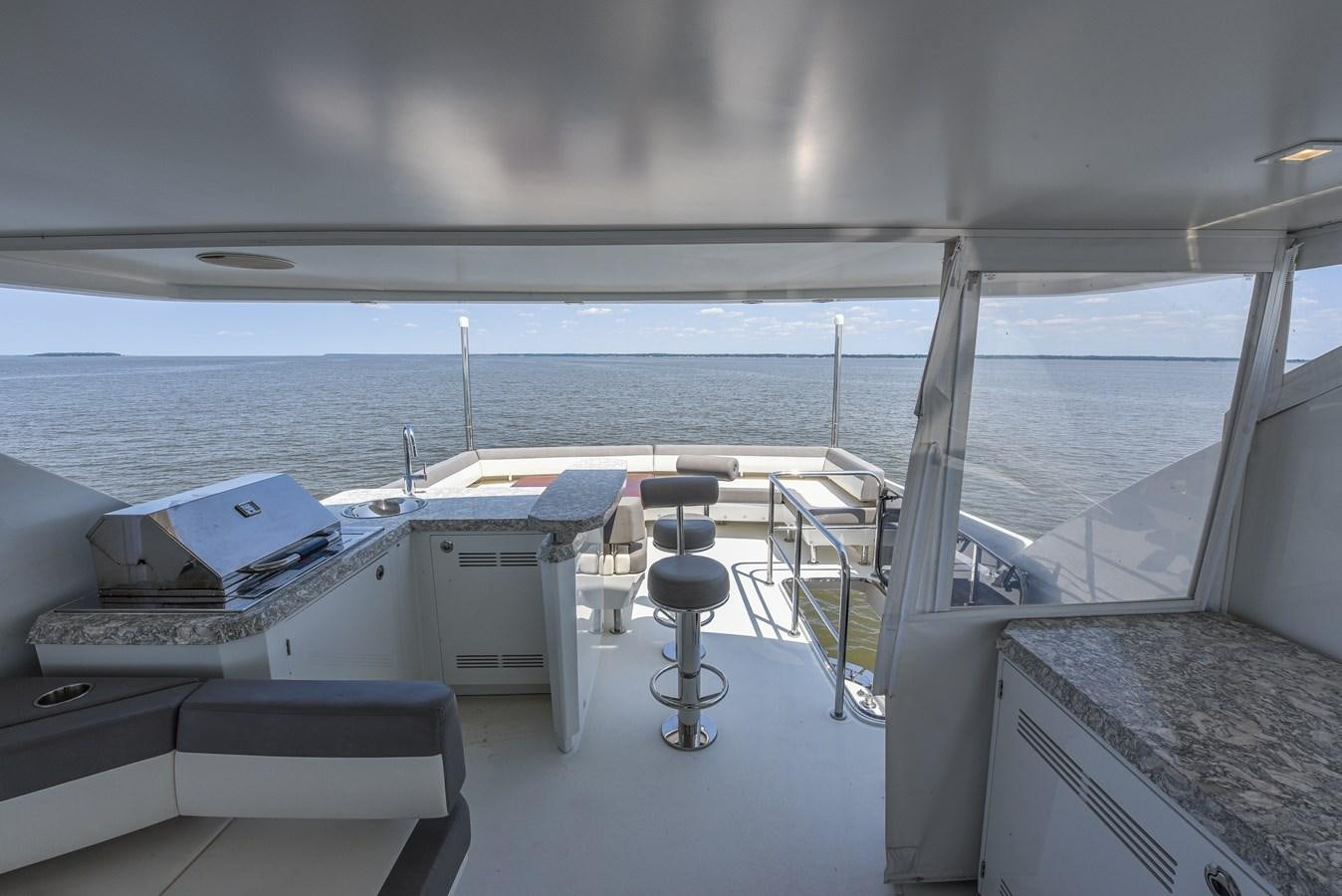 a boat with a desk and chairs aboard 70E Yacht for Sale