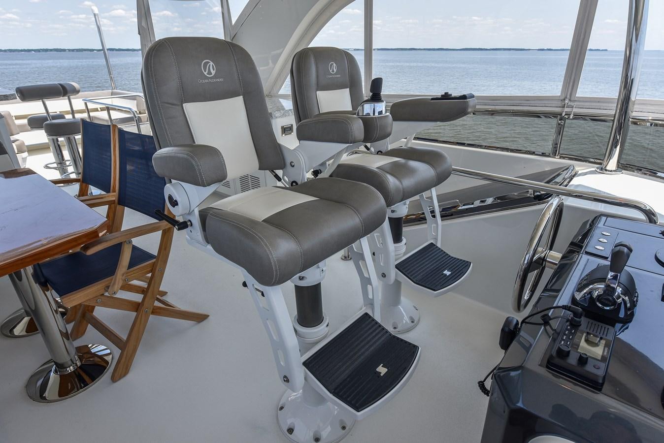 a black chair on a boat aboard 70E Yacht for Sale