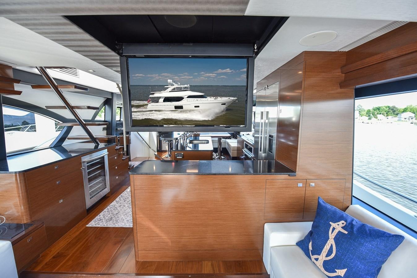 a room with a large window and a large screen aboard 70E Yacht for Sale