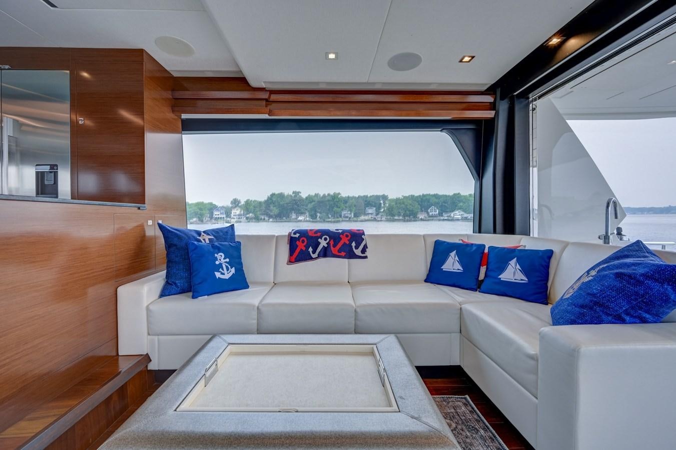 a white couch in a room aboard 70E Yacht for Sale