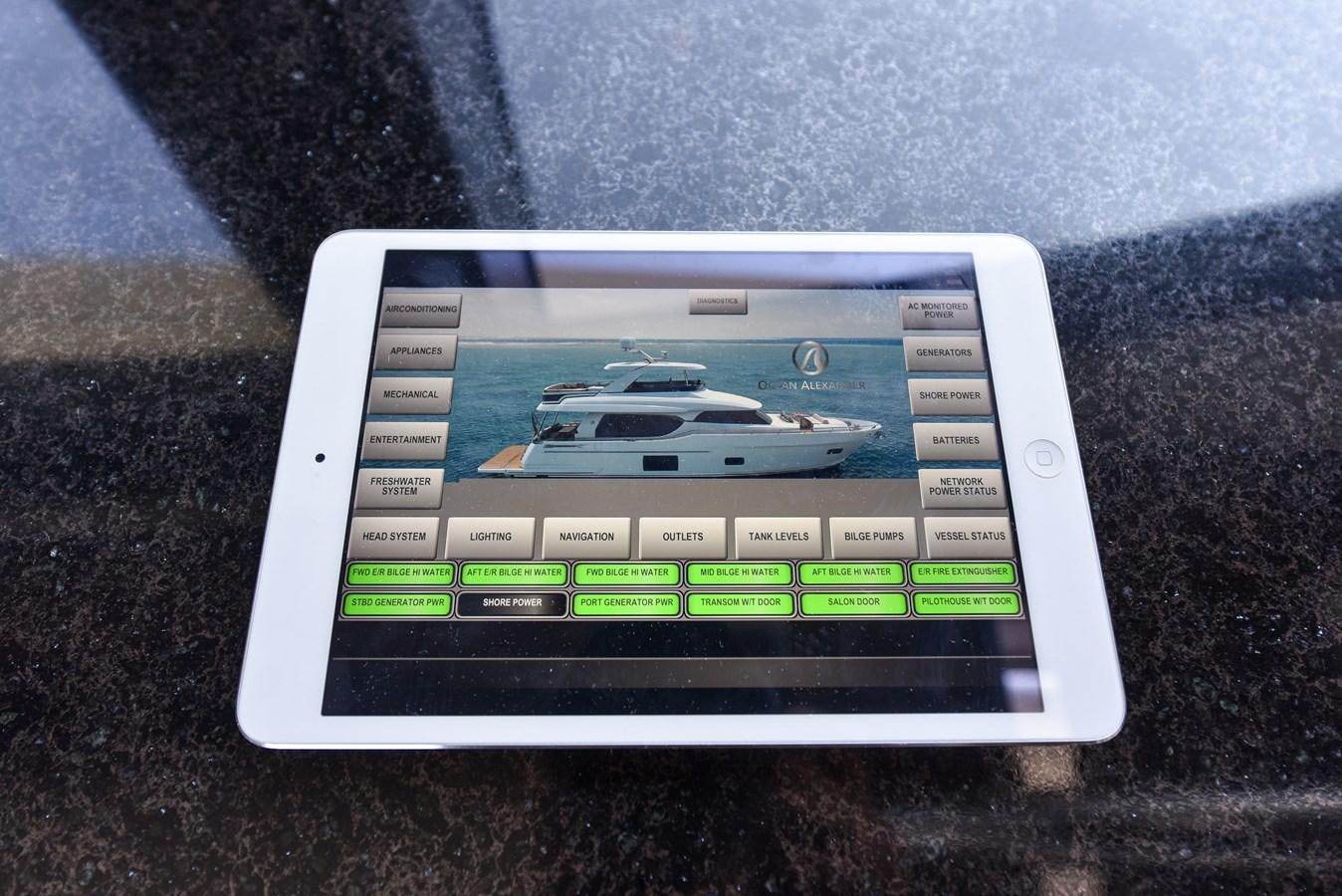 a small white laptop aboard 70E Yacht for Sale