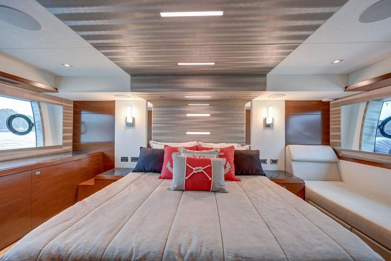 a large bed in a room aboard 70E Yacht for Sale