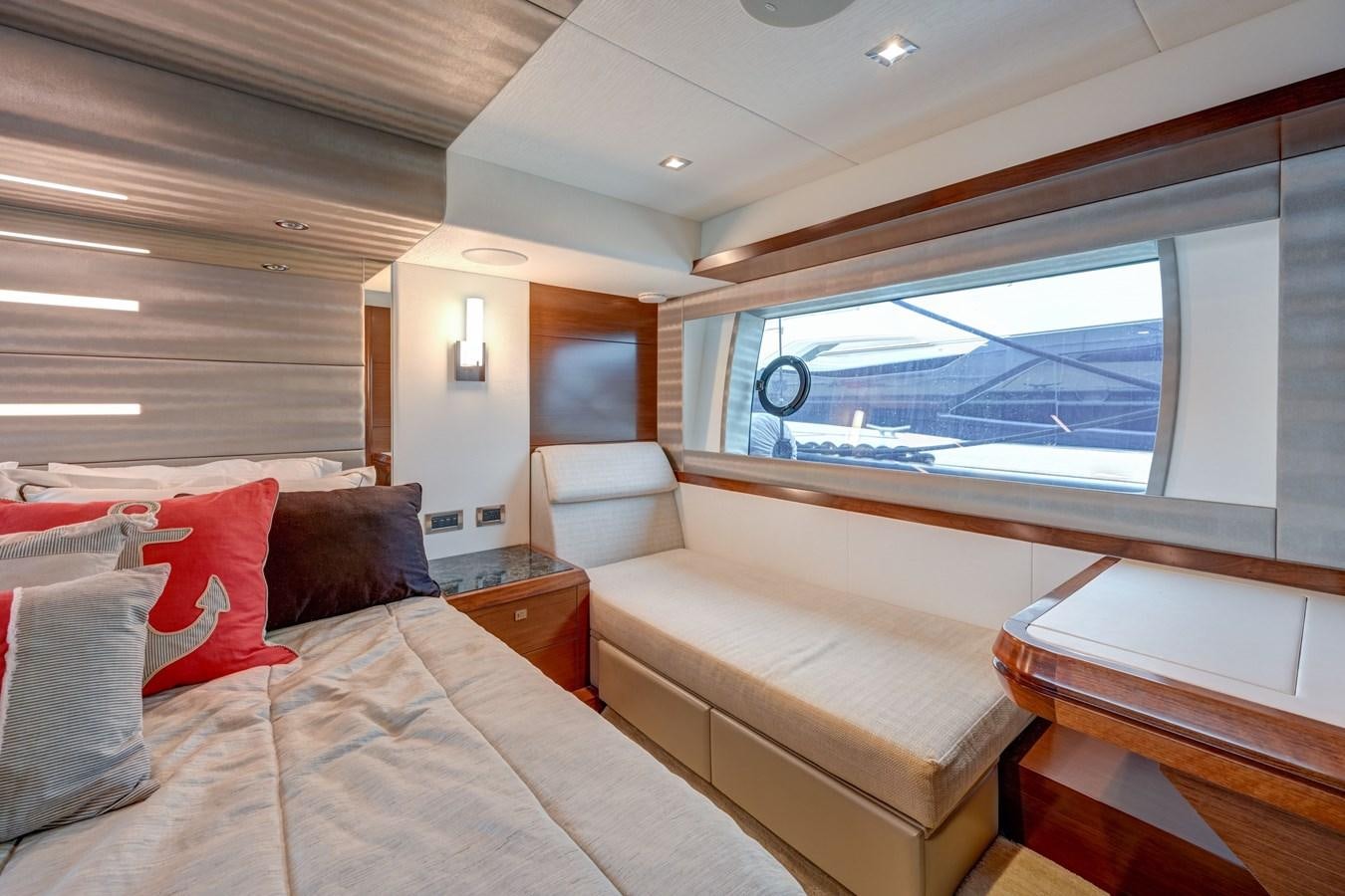 a room with a bed and a window aboard 70E Yacht for Sale