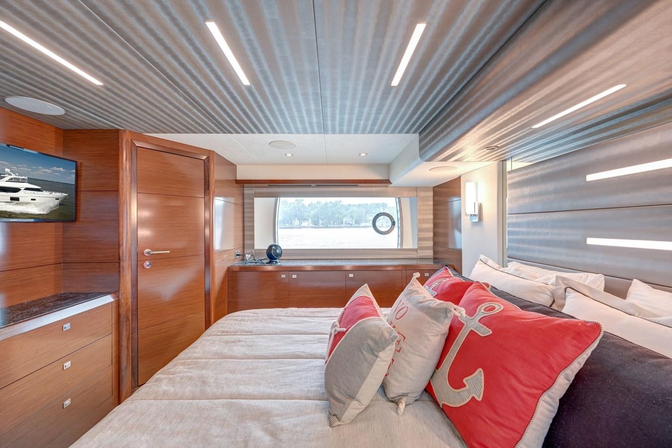 a bed in a room aboard 70E Yacht for Sale