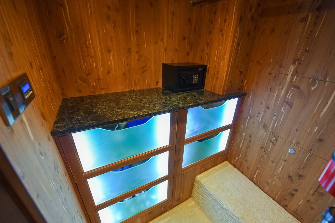 a kitchen with a bar and a microwave aboard 70E Yacht for Sale