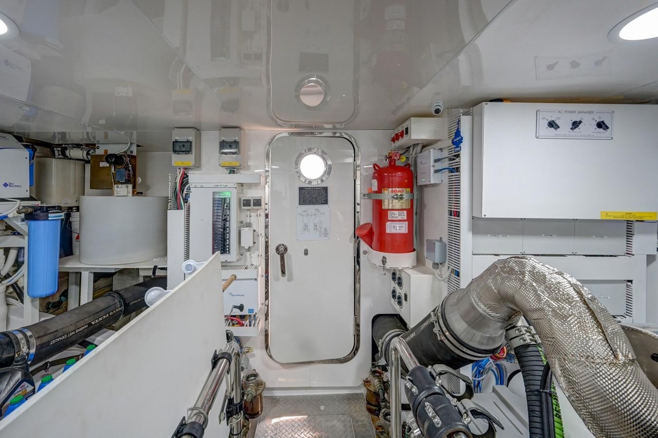 a person in a room with equipment aboard 70E Yacht for Sale