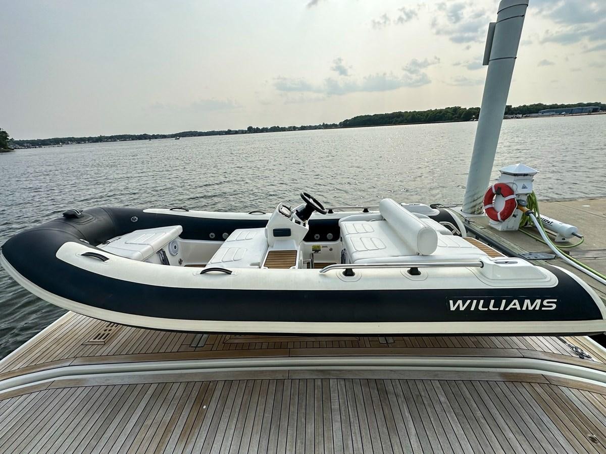 a boat on a dock aboard 70E Yacht for Sale