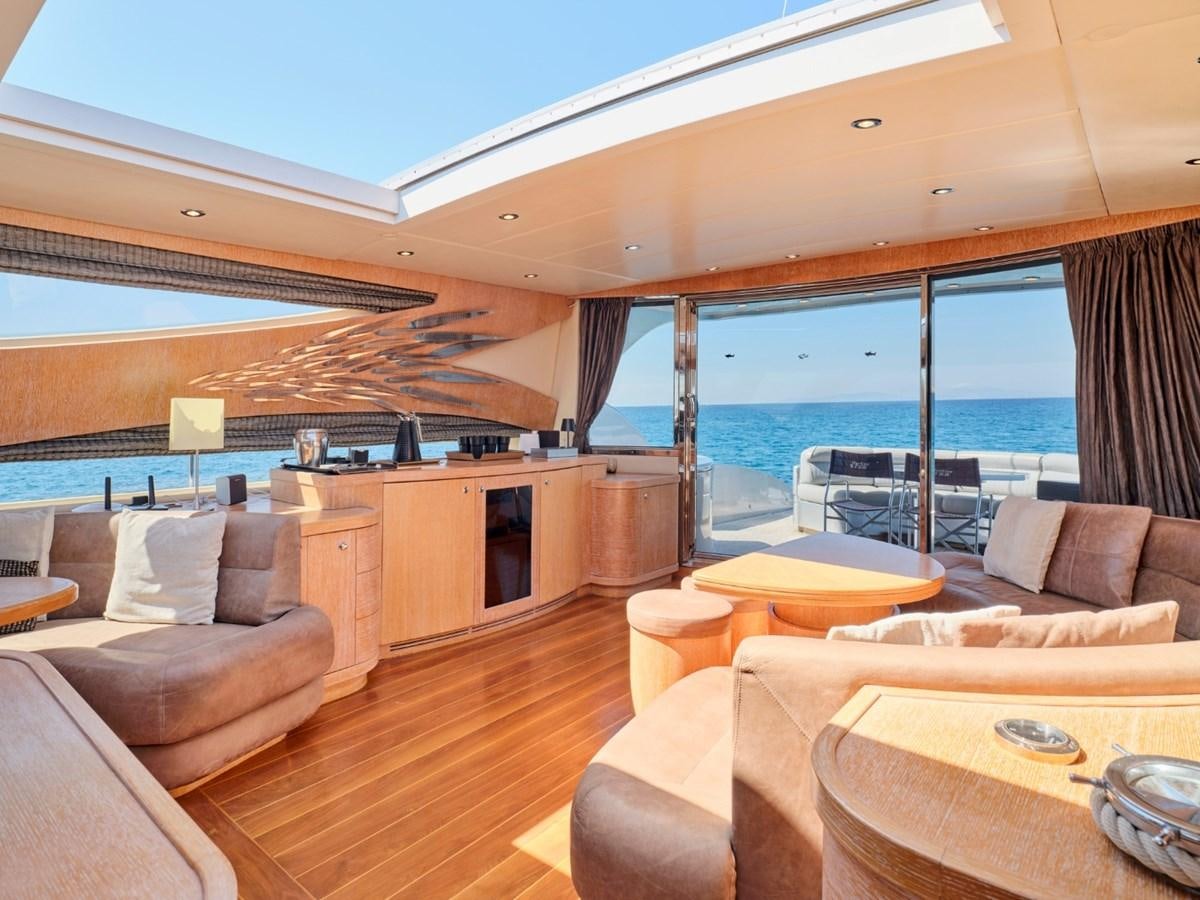 a living room with a large window aboard HUNTING STAR Yacht for Sale