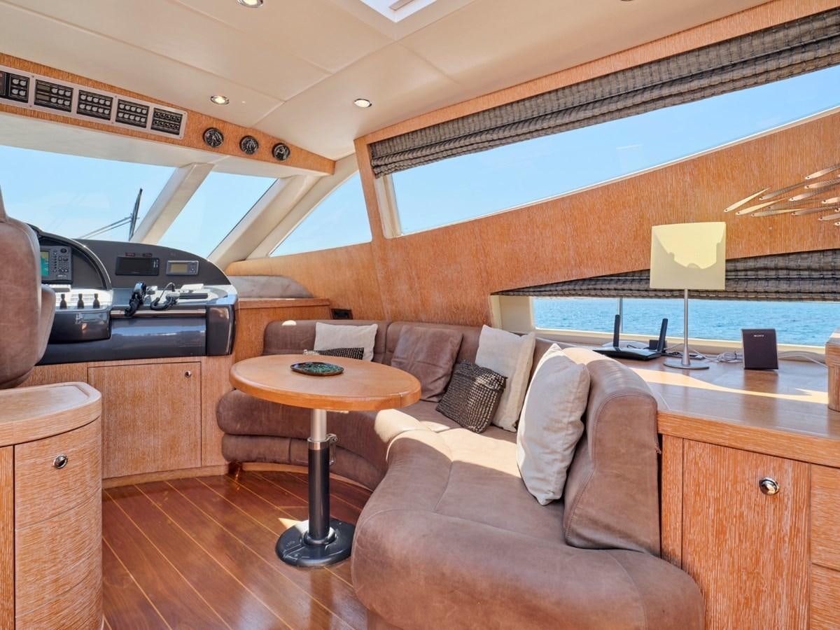 a living room with a couch and a table aboard HUNTING STAR Yacht for Sale