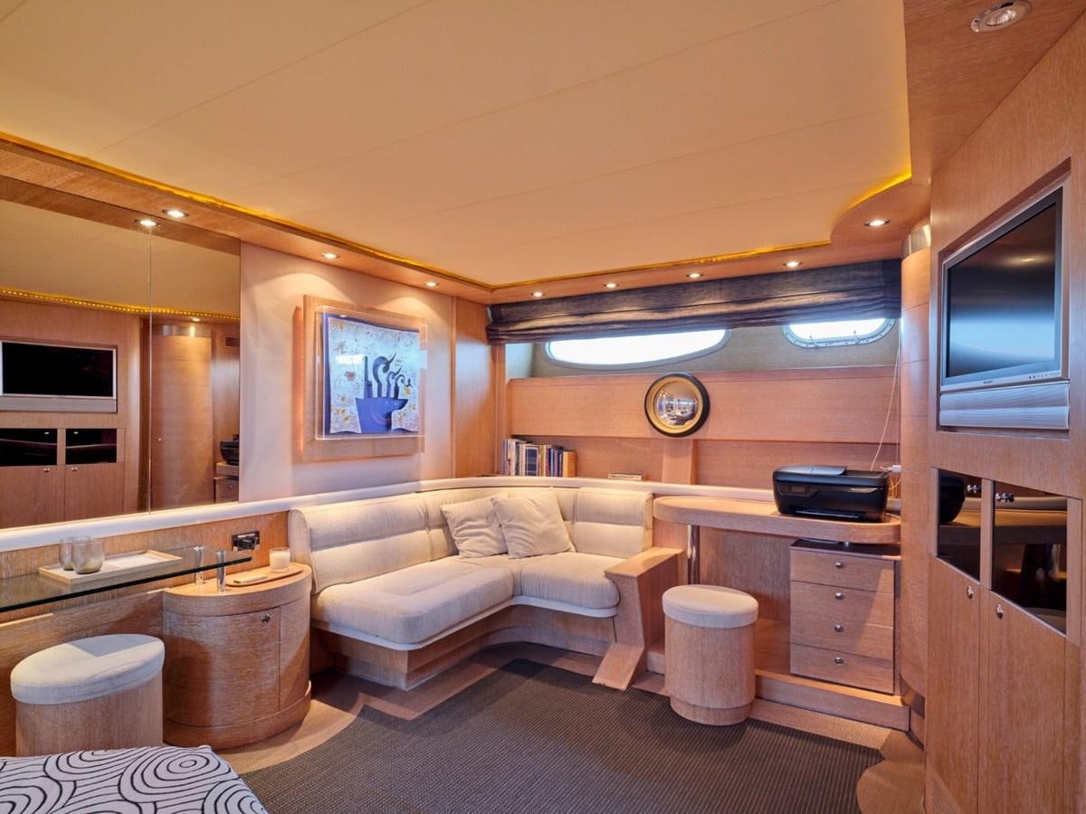 a living room with a couch and a television aboard HUNTING STAR Yacht for Sale