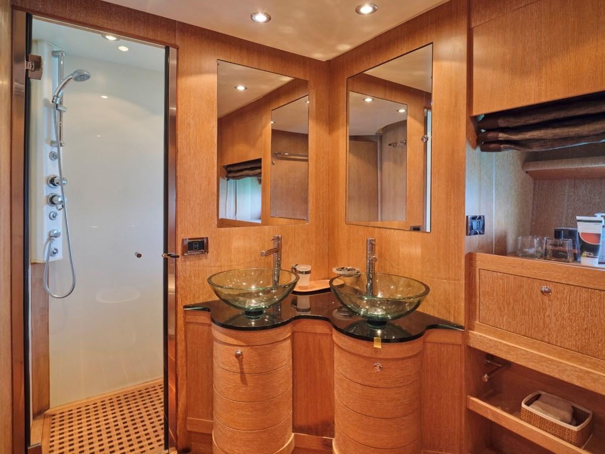 a bathroom with a sink and a shower aboard HUNTING STAR Yacht for Sale